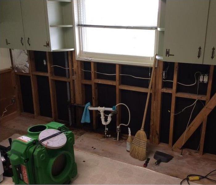 Kitchen with framework showing and SERVPRO equipment