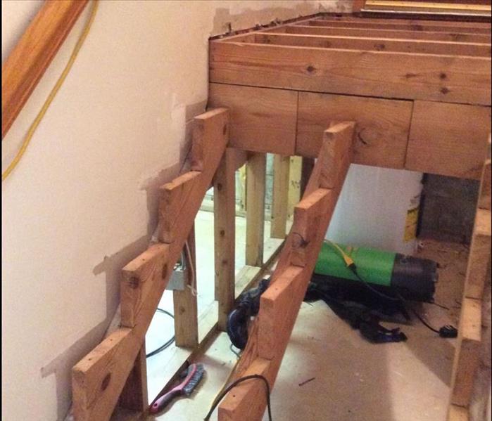 wood framing of a stairwell exposed