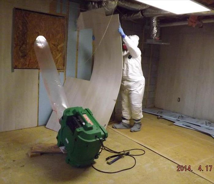 employee with air scrubber set-up