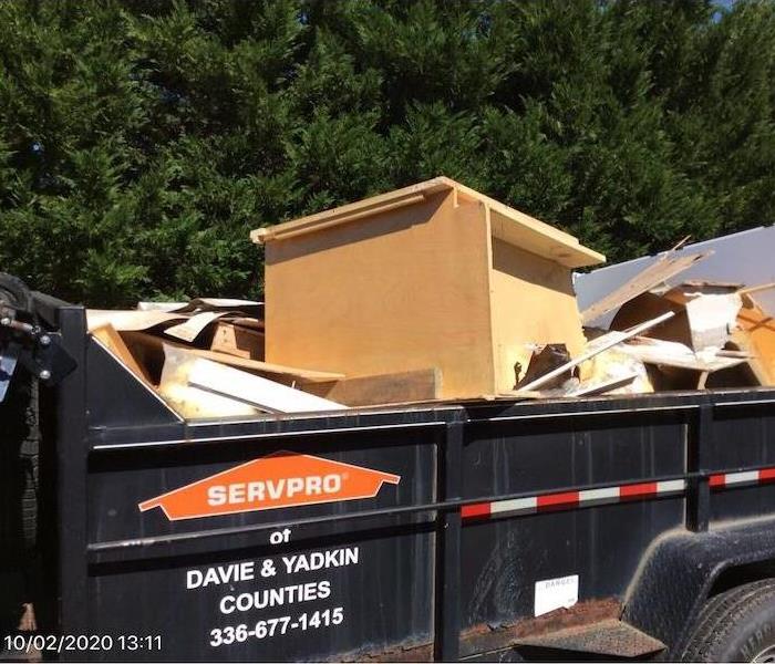 SERVPRO dumpster with various articles 