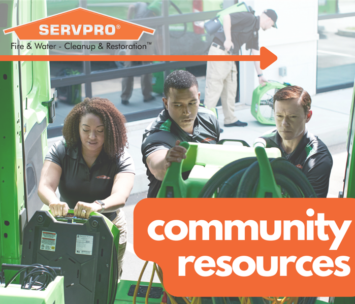 Community Resources - technicians loading SERVPRO vehicle